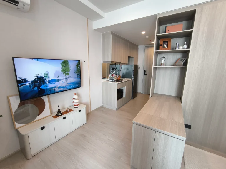 Reference Sathorn - Wongwianyai luxury condominium studio actual condo unit media console wall and compact kitchen area