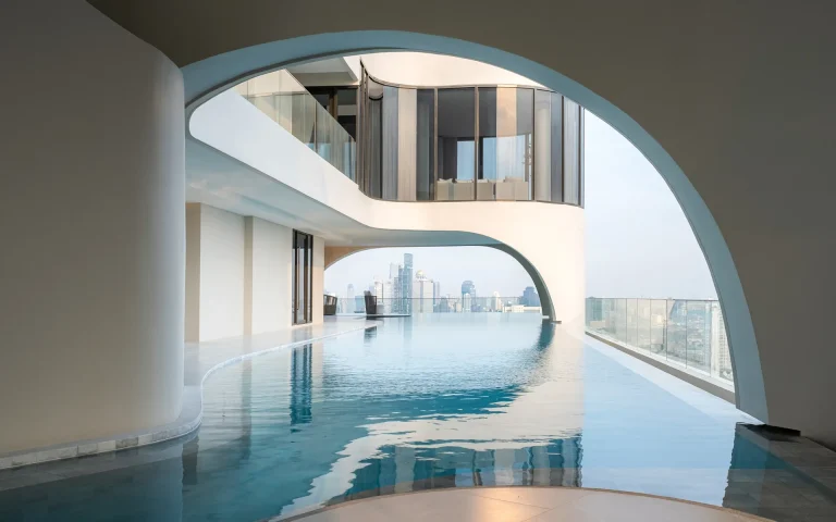 Reference Sathorn - Wongwianyai luxury condo rooftop sky infinity pool framed by architectural archway