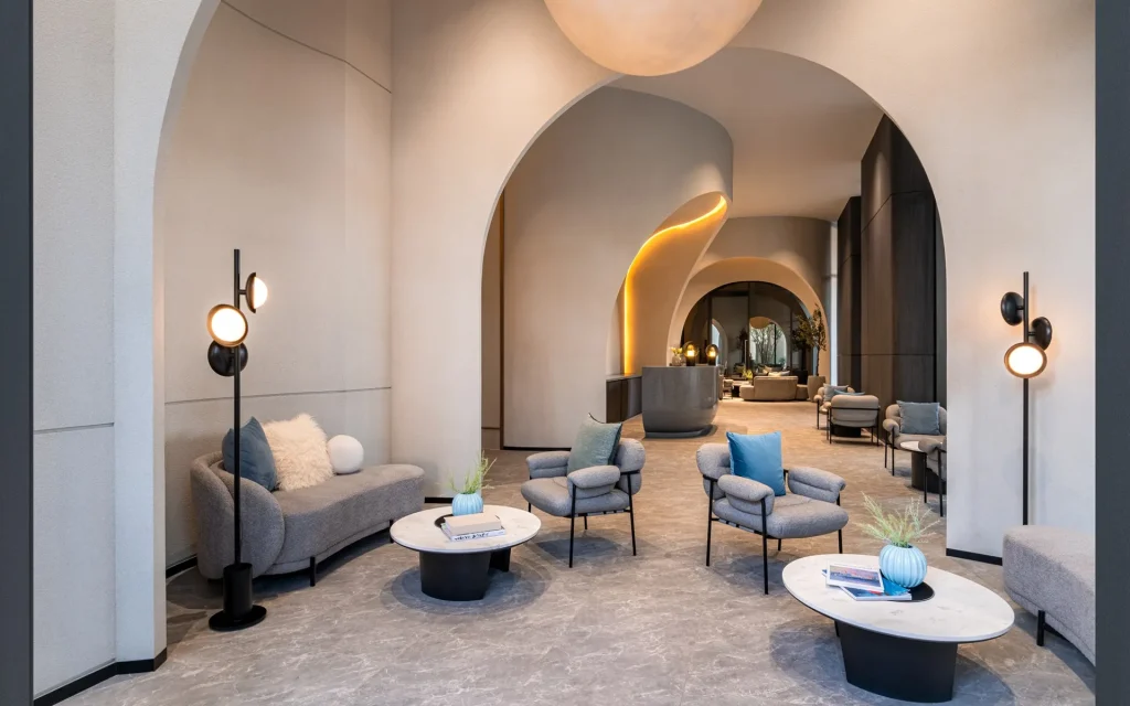Reference Sathorn - Wongwianyai luxury condominium main welcome lounge seating area with arched doorways