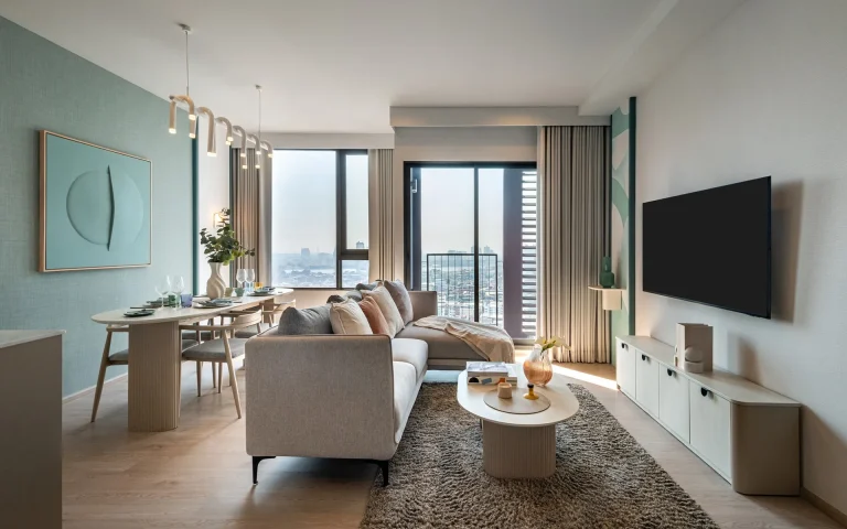 Reference Sathorn - Wongwianyai 2-bedroom luxury condo living room interior design with dining area and balcony
