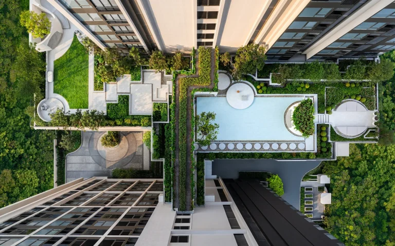 Reference Sathorn - Wongwianyai luxury condominium top-down aerial drone view of rooftop swimming pool and landscaped gardens